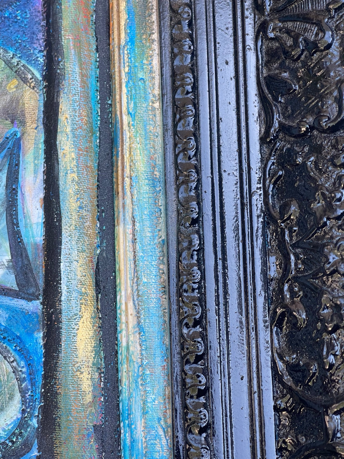 Detail of ornate black frame and painted edge